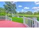 Scenic backyard view from the deck overlooking a tranquil pond and golf course at 109 Waveney Cir, Goose Creek, SC 29445