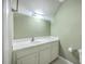Simple bathroom showcasing a vanity with a white sink, classic fixtures, and neutral-colored walls at 109 Waveney Cir, Goose Creek, SC 29445