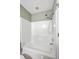 Clean bathroom with a combined tub and shower, featuring all-white tiling and fixtures for a fresh look at 109 Waveney Cir, Goose Creek, SC 29445