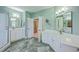 Bright bathroom with double sinks, granite countertops, and a glass-enclosed shower at 109 Waveney Cir, Goose Creek, SC 29445