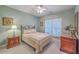 Charming bedroom with a decorative iron bed frame, complemented by a cozy quilt and wood furniture at 109 Waveney Cir, Goose Creek, SC 29445