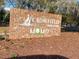 Crowfield Golf Club sign with green logo on a brick wall, set in a mulched area with landscaping at 109 Waveney Cir, Goose Creek, SC 29445