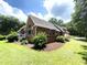 Brick house featuring a screened porch and attractive landscaping at 109 Waveney Cir, Goose Creek, SC 29445
