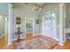 Elegant foyer with high ceilings, hardwood floors, and a stylish chandelier at 109 Waveney Cir, Goose Creek, SC 29445