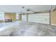 Spacious two-car garage with concrete floor, two overhead doors, and a window providing natural light at 109 Waveney Cir, Goose Creek, SC 29445