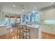 Open-concept kitchen with island, bar seating, and stainless steel appliances at 109 Waveney Cir, Goose Creek, SC 29445