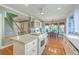 Spacious kitchen with island cooktop, adjacent breakfast area, and hardwood floors at 109 Waveney Cir, Goose Creek, SC 29445