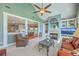A spacious living room with a fireplace, ceiling fan, comfortable seating and view to dining and kitchen at 109 Waveney Cir, Goose Creek, SC 29445