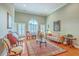 Spacious living room featuring tall ceilings, shuttered windows and hardwood flooring at 109 Waveney Cir, Goose Creek, SC 29445
