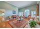 Bright living room with high ceilings, hardwood floors, and a decorative rug at 109 Waveney Cir, Goose Creek, SC 29445