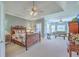 Spacious primary bedroom with a sitting area, ceiling fan and lots of natural light at 109 Waveney Cir, Goose Creek, SC 29445