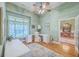 Bright and spacious office area with a white desk, wooden floors, and access to the dining room at 109 Waveney Cir, Goose Creek, SC 29445