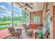 Relaxing screened porch features a hot tub and comfortable seating area, perfect for outdoor living at 109 Waveney Cir, Goose Creek, SC 29445