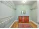 Walk-in closet with metal shelving, wooden dresser, rug on wood floor and lots of natural light at 109 Waveney Cir, Goose Creek, SC 29445