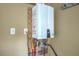 Wall-mounted tankless water heater with visible plumbing and connections against a neutral wall at 109 Waveney Cir, Goose Creek, SC 29445