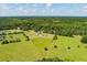 Aerial shot displaying serene location with long road and private, tree-lined surroundings at 1111 Sandy Springs Circle, Walterboro, SC 29488