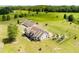 This aerial view shows a home, a detached garage, a landscaped backyard, and a fenced backyard at 1111 Sandy Springs Circle, Walterboro, SC 29488