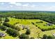 An aerial view illustrates a home situated on an extensive lot, showcasing approximated boundary lines and mature trees at 1111 Sandy Springs Circle, Walterboro, SC 29488