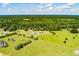 The aerial view showcases the property, its expansive grounds, and lush surroundings at 1111 Sandy Springs Circle, Walterboro, SC 29488
