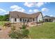 Spacious backyard featuring a patio, fire pit, and well-maintained landscaping at 1111 Sandy Springs Circle, Walterboro, SC 29488