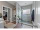 Elegant bathroom featuring a modern shower with glass enclosure and storage shelves at 1111 Sandy Springs Circle, Walterboro, SC 29488