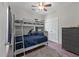 bedroom features a bunk bed with ladder, ceiling fan, and gray dresser at 1111 Sandy Springs Circle, Walterboro, SC 29488