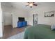 Bedroom featuring tiled floors, blue dresser, ceiling fan, and walk-in closet at 1111 Sandy Springs Circle, Walterboro, SC 29488