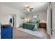 Spacious bedroom with green bedding, ceiling fan, tiled floor, and walk-in closet at 1111 Sandy Springs Circle, Walterboro, SC 29488