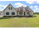 Charming two-story home with a covered front porch and beautifully landscaped front yard at 1111 Sandy Springs Circle, Walterboro, SC 29488