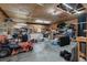 Spacious garage with overhead storage and various tools and equipment at 1111 Sandy Springs Circle, Walterboro, SC 29488