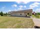 View of the garage with two bays and an attached covered area on a large lot with green grass at 1111 Sandy Springs Circle, Walterboro, SC 29488