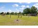 View of a fenced garden area with a gate and lush green grass, perfect for gardening enthusiasts at 1111 Sandy Springs Circle, Walterboro, SC 29488