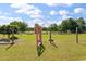 View of a fenced garden area with a gate and lush green grass, providing space to garden at 1111 Sandy Springs Circle, Walterboro, SC 29488