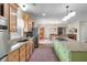 Bright kitchen boasts an island with cooktop, stainless appliances, and tile backsplash at 1111 Sandy Springs Circle, Walterboro, SC 29488