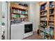 Functional laundry room with ample shelving, a washer, and a dryer at 1111 Sandy Springs Circle, Walterboro, SC 29488