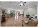 Spacious living area with a seamless flow to the kitchen, featuring hardwood flooring and ample lighting at 1111 Sandy Springs Circle, Walterboro, SC 29488
