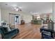 Bright living area connects to the kitchen, showcasing hardwood floors and versatile layout at 1111 Sandy Springs Circle, Walterboro, SC 29488