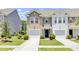 Charming townhome featuring a well-manicured lawn and a one car garage at 113 Cozy Nest Way, Summerville, SC 29483