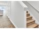 Hallway with wood floors and carpeted stairs in a light and bright home at 113 Cozy Nest Way, Summerville, SC 29483