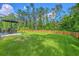 Spacious backyard includes a patio set under an umbrella, perfect for outdoor relaxation and entertaining at 115 Cooper Dr, Summerville, SC 29483