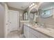 Bathroom featuring double vanity with granite countertop, dual sinks and framed mirrors at 115 Cooper Dr, Summerville, SC 29483