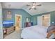 Bedroom featuring neutral carpet, vaulted ceiling, TV and adjacent bathroom at 115 Cooper Dr, Summerville, SC 29483