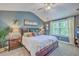 Bedroom with vaulted ceiling, neutral carpet, craftsman trim, large window and elegant decor at 115 Cooper Dr, Summerville, SC 29483