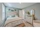 Cozy bedroom with neutral decor, a comfortable upholstered bed, and natural light from the bright window at 115 Cooper Dr, Summerville, SC 29483