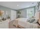 Bright bedroom with a comfy upholstered bed, neutral decor, and plenty of natural light from the window at 115 Cooper Dr, Summerville, SC 29483