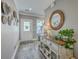 Inviting foyer with decorative accents, a wooden mirror, a console table, and neutral color scheme at 115 Cooper Dr, Summerville, SC 29483
