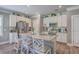 Bright eat-in kitchen featuring stainless appliances, granite counters, and a large island with bar stool seating at 115 Cooper Dr, Summerville, SC 29483