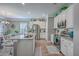 Modern kitchen with stainless steel appliances, white cabinets, granite counters and a large island at 115 Cooper Dr, Summerville, SC 29483