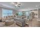 Open-concept living room showcasing a large sectional sofa, dining area, and kitchen island at 115 Cooper Dr, Summerville, SC 29483