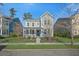 Charming two-story home with a quaint front porch and a well-manicured front lawn at 121 Warbler Way, Summerville, SC 29483
